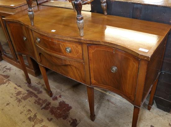 A George III style inlaid mahogany serpentine front sideboard